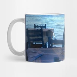 Scenic view on Mediterranean sea from Greek restaurant with blue chairs Mug